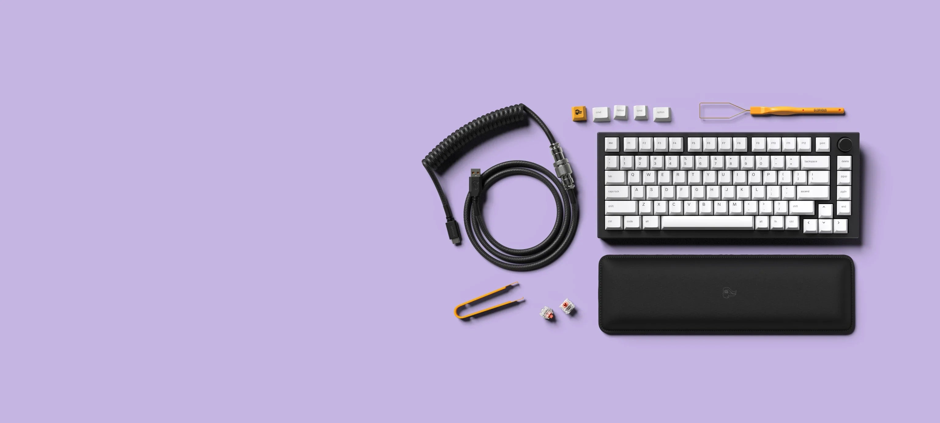 GMMK PRO Prebuilt full kit includes a black coiled cable, switch and keycap pullers, and a padded wrist rest to go with your prebuilt keyboard.