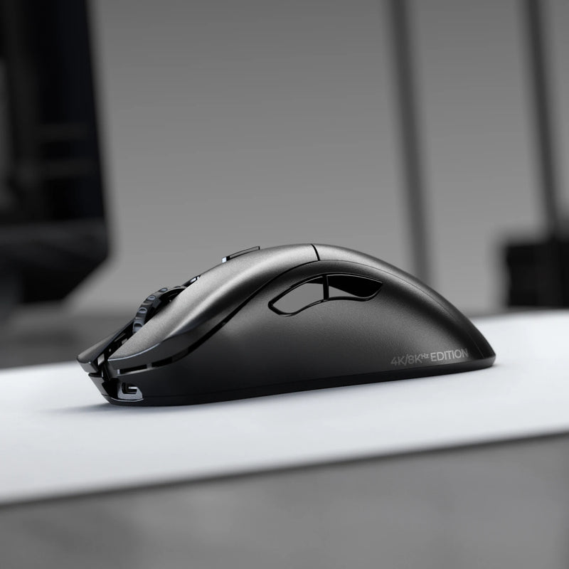 Left side view of the Model D 2 PRO Wireless Mouse 4K/8KHz Edition in Black on top of a white mousepad