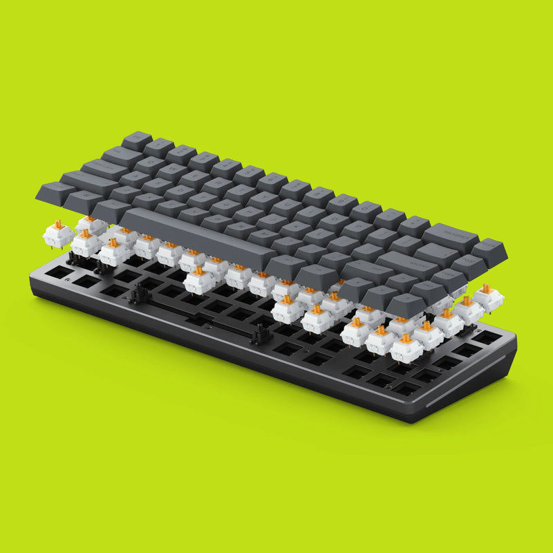 A Black GMMK 2 65% Barebones with GPBT Black Ash Keycaps is shown in an exploded view, revealing Glorious Panda switches beneath the keys. The background is a bright lime green.