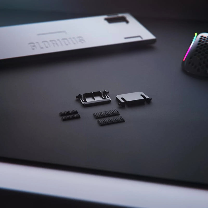 GMMK 2 Replacement Kit feet in black on a black mousepad