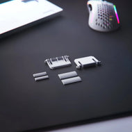 GMMK 2 Replacement Kit feet in white on a black mousepad