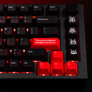 Close up of novelty keys from the GPBT Kabuto keycap set, featuring red samurai swords and samurai mask keys