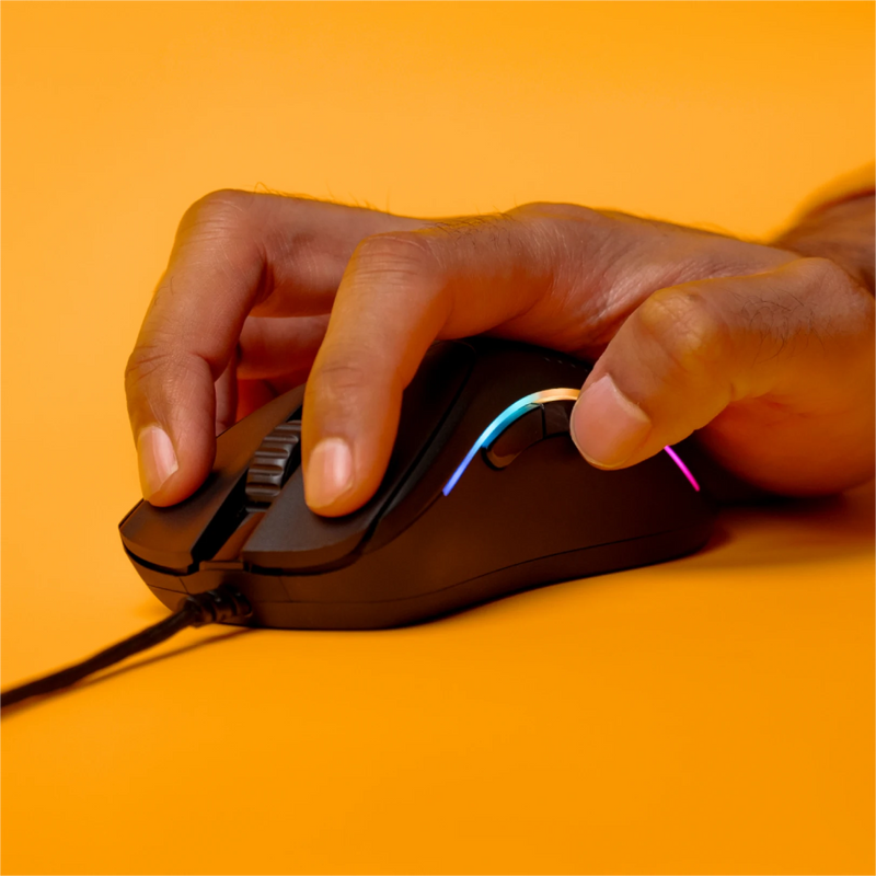 Front view of a hand using a claw grip to hold a Model D 2 Wired in Black on an orange background