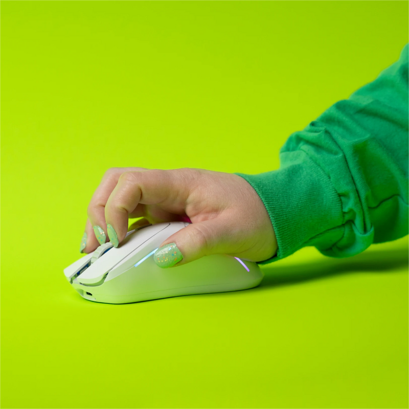 Left side view of a hand using a claw grip to hold a Model D 2 Wireless in White on a green background