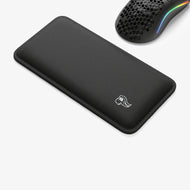 Padded Mouse Wrist Rest next to a Model O Wired mouse