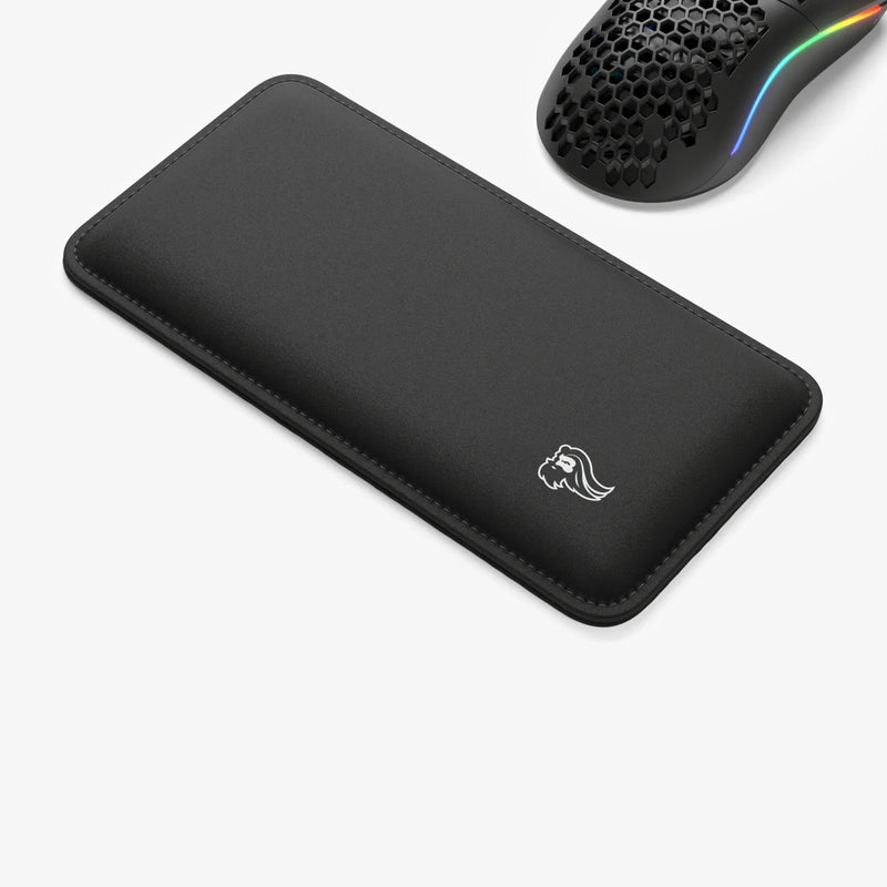Padded Mouse Wrist Rest next to a Model O Wired mouse