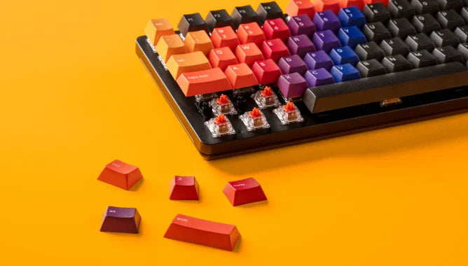 Celestial keycaps on a black GMMK 2 keyboard against an orange background