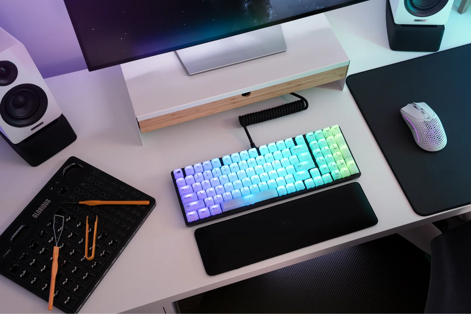 Polychroma Keycaps on a keyboard with blue purple and green lighting